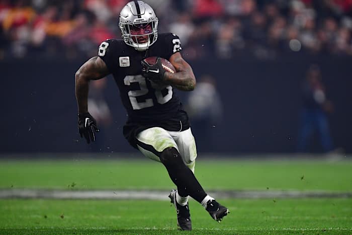 Las Vegas Raiders running back Josh Jacobs (28) runs the ball against the Kansas City Chiefs during the second half at Allegiant Stadium.